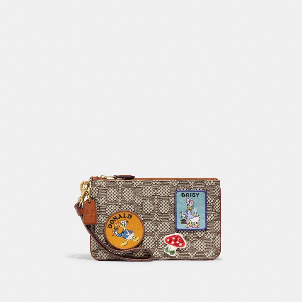 CH493 - Disney X Coach Small Wristlet In Signature Textile Jacquard With Patches Brass/Cocoa Burnished Amb