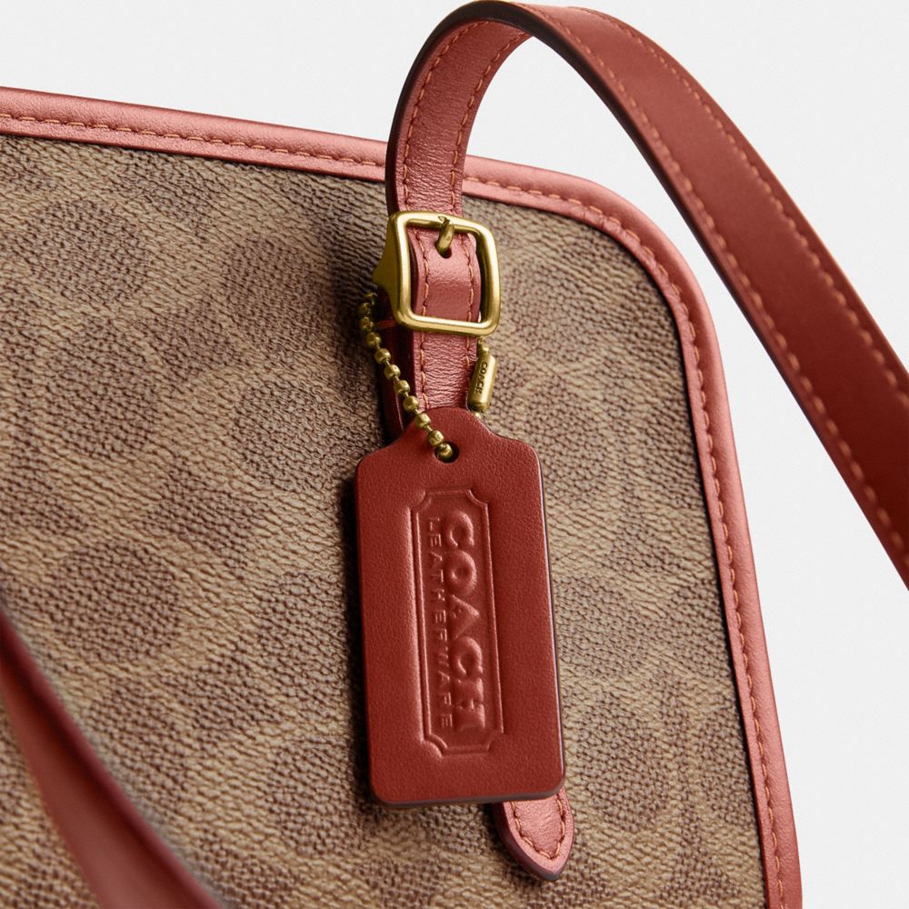 COACH Official Site Official page | SWING ZIP IN SIGNATURE CANVAS