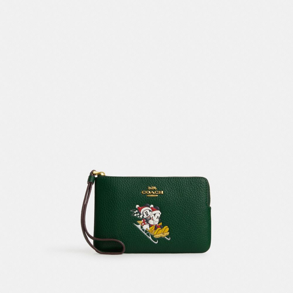 Disney X Coach Corner Zip Wristlet With Sled Motif - CN025 - Brass/Dark Pine