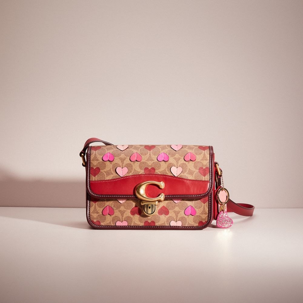 CN248 - Upcrafted Studio Shoulder Bag In Signature Canvas With Heart Print Brass/Tan Red Apple