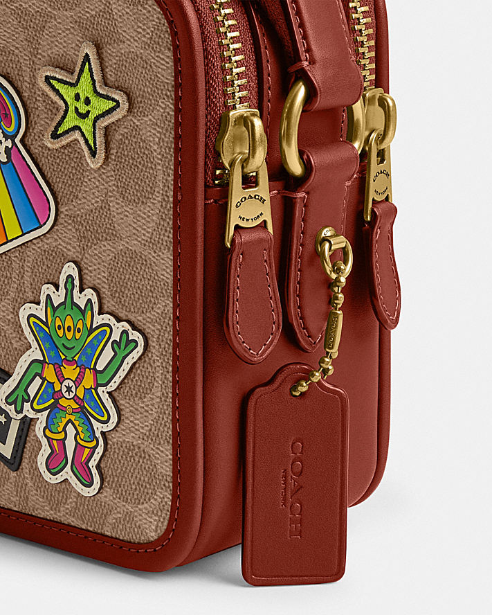 COSMIC COACH CHARTER CROSSBODY 24 IN SIGNATURE CANVAS WITH PATCHES