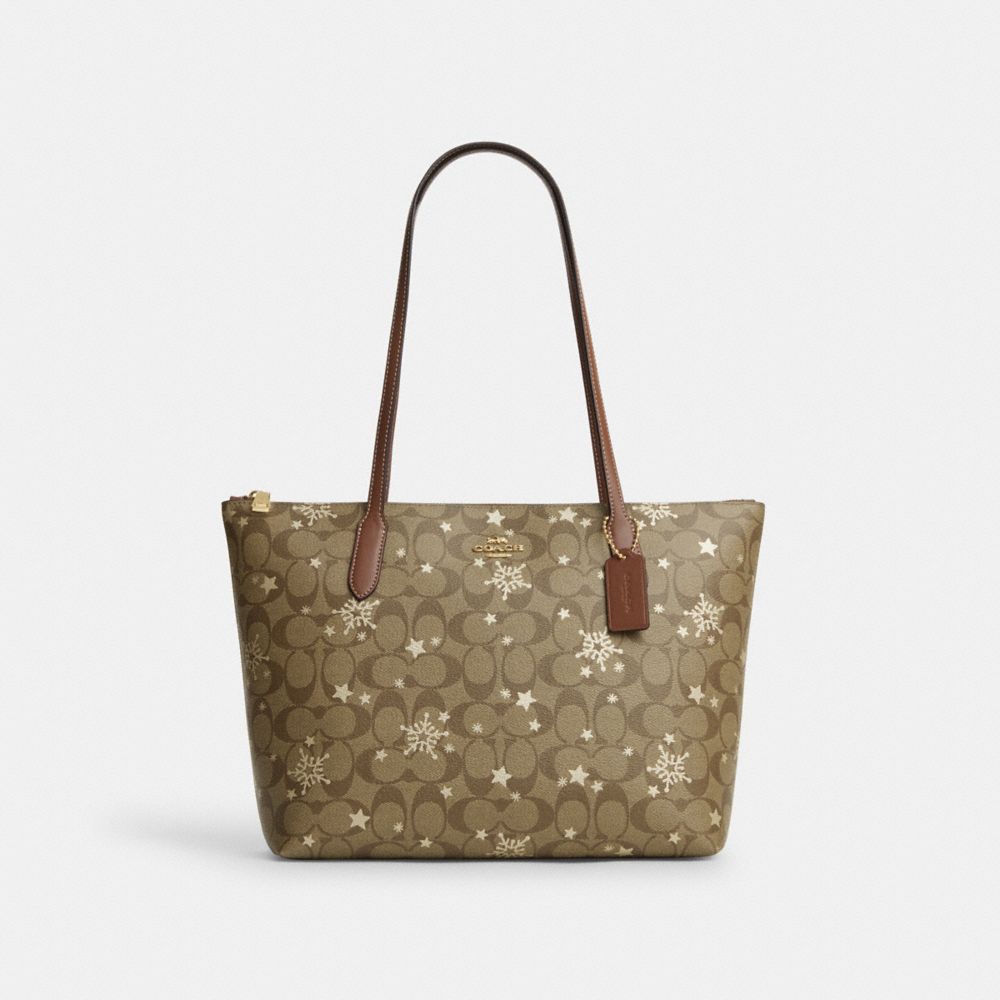 COACH CN671 Zip Top Tote In Signature Canvas With Star And Snowflake Print IM/KHAKI SADDLE/GOLD MULTI