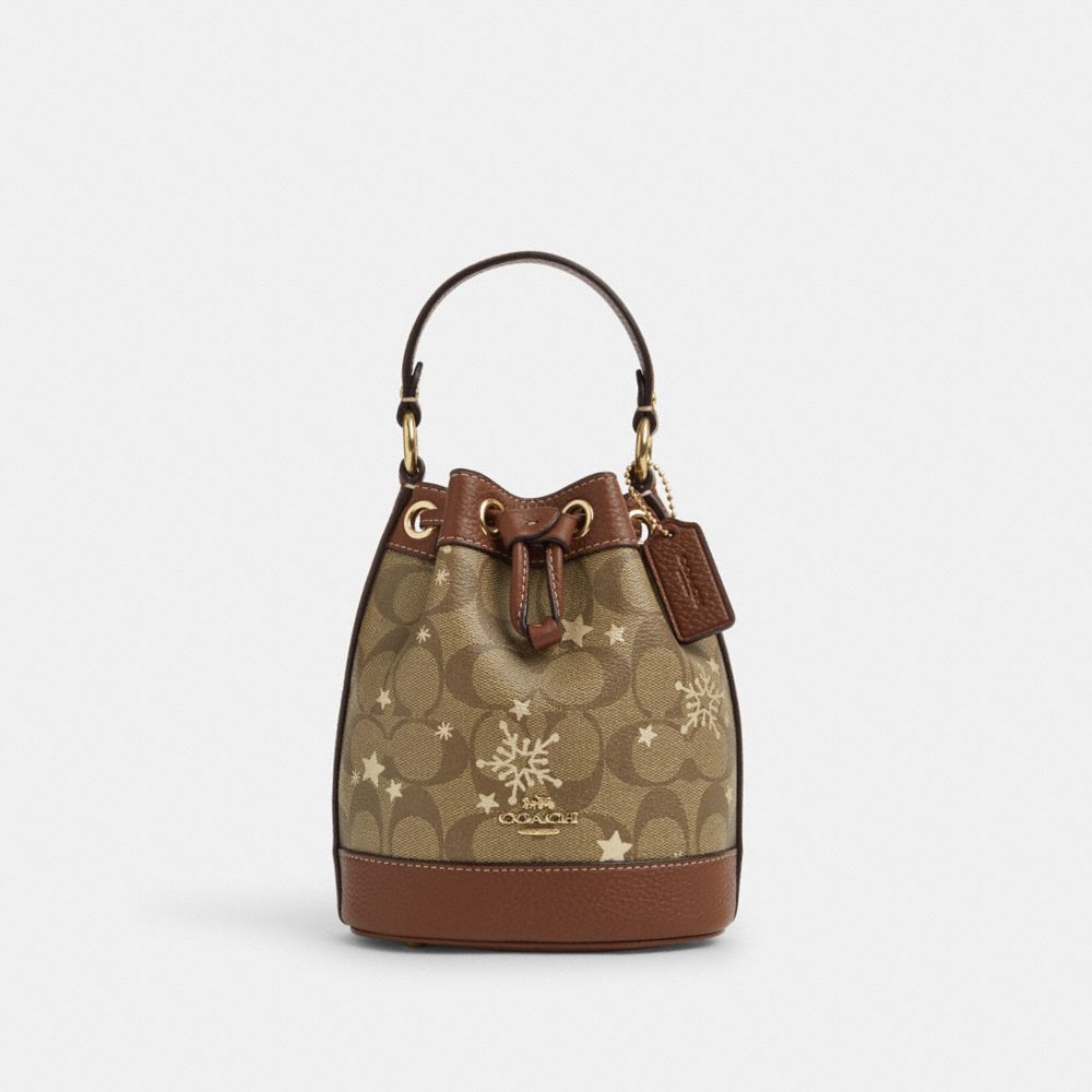 COACH CN679 Dempsey Drawstring Bucket Bag 15 In Signature Canvas With Star And Snowflake Print Im/Khaki Saddle/Gold Multi