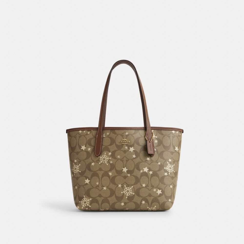 COACH CN682 Mini City Tote In Signature Canvas With Star And Snowflake Print IM/KHAKI SADDLE/GOLD MULTI