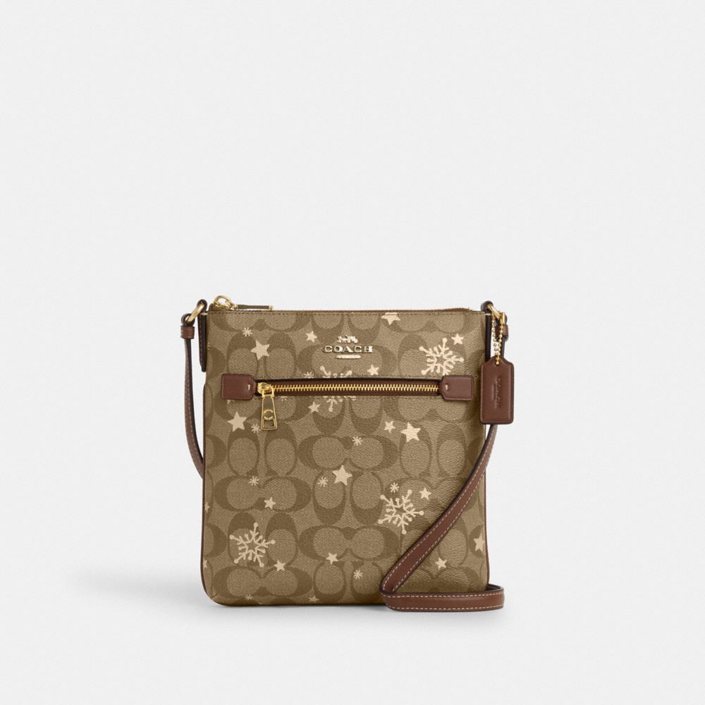 COACH CN766 Mini Rowan File Bag In Signature Canvas With Star And Snowflake Print IM/KHAKI SADDLE/GOLD MULTI