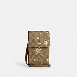 North South Phone Crossbody In Signature Canvas With Star And Snowflake Print - CN770 - Im/Khaki Saddle/Gold Multi