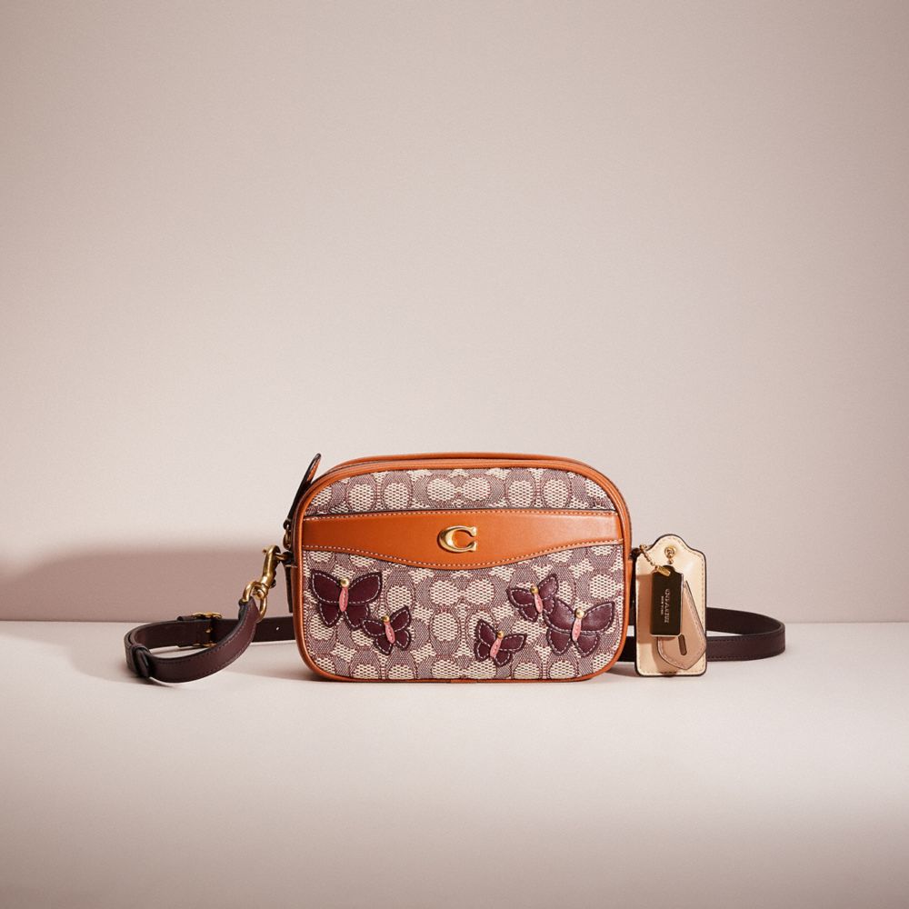 CN872 - Upcrafted Camera Bag In Signature Textile Jacquard Brass/Cocoa Burnished Amber