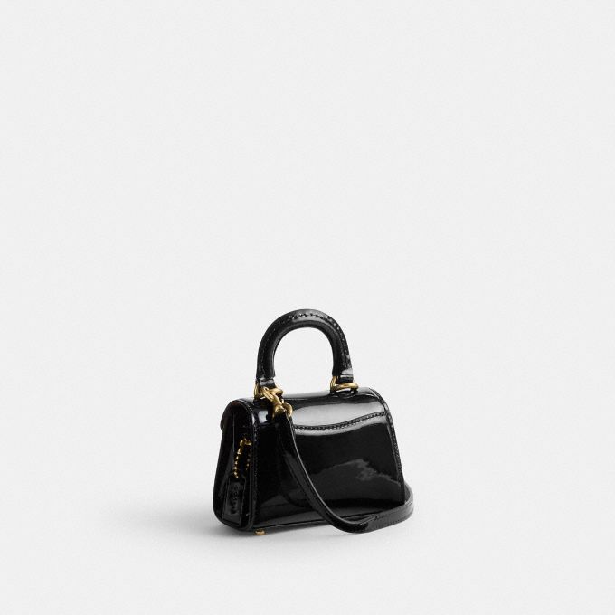 Top handle pouch in signature online leather