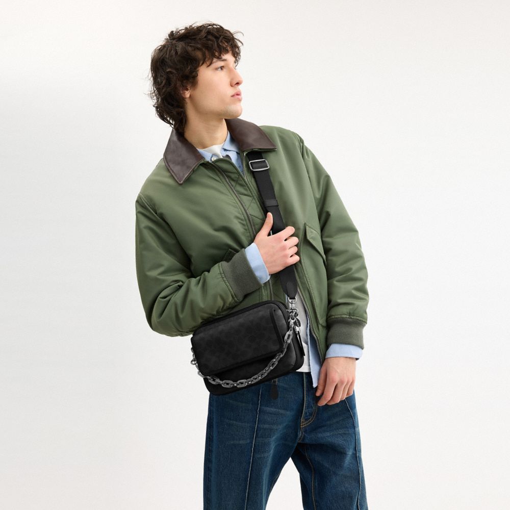 CHARTER FLAP CROSSBODY 24 IN SIGNATURE CANVAS