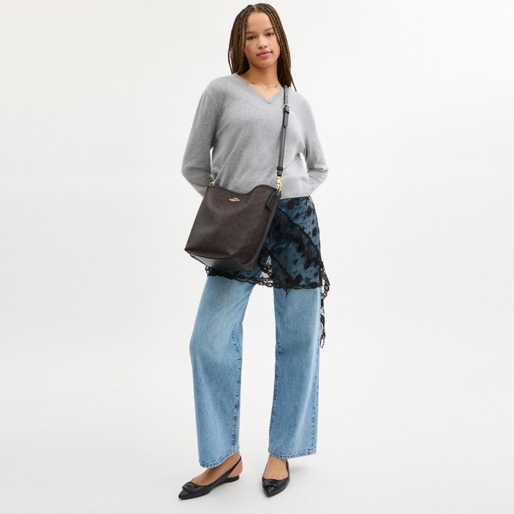 CITY LARGE BUCKET BAG IN SIGNATURE CANVAS