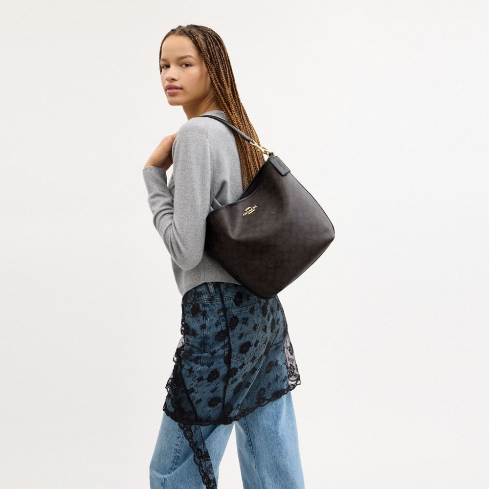 CITY LARGE BUCKET BAG IN SIGNATURE CANVAS
