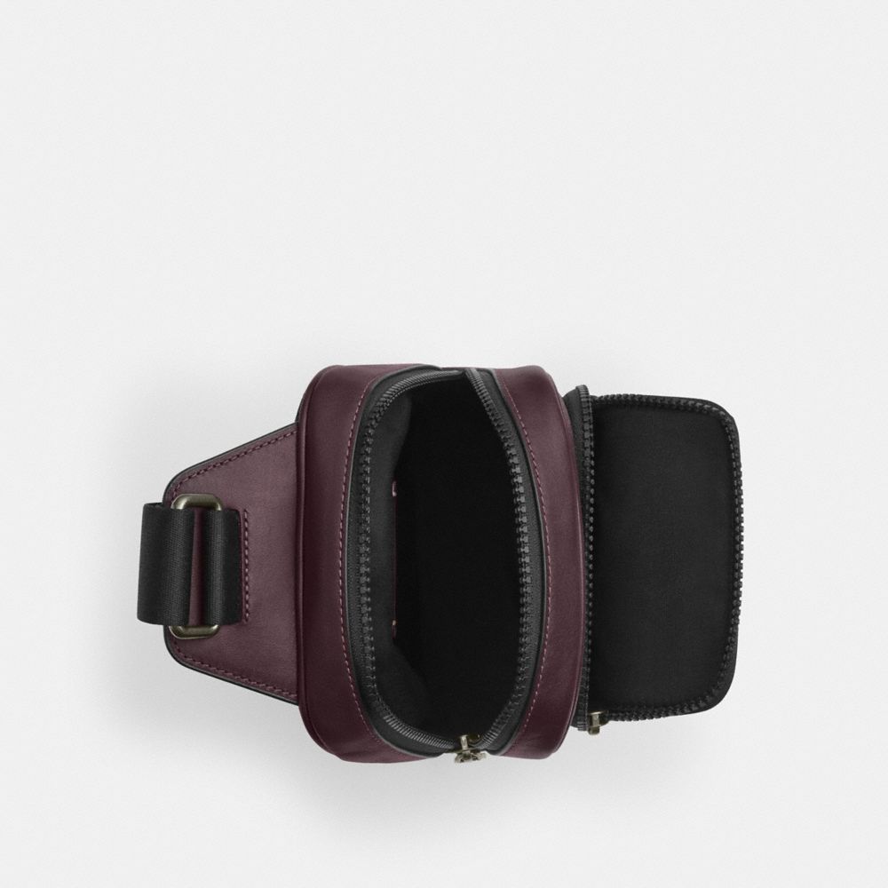 RACER SLING PACK IN SIGNATURE CANVAS