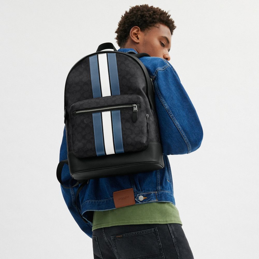 WEST BACKPACK IN SIGNATURE CANVAS WITH VARSITY STRIPE