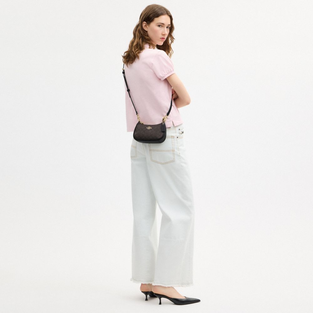 TERI MINI CROSSBODY BAG IN SIGNATURE CANVAS