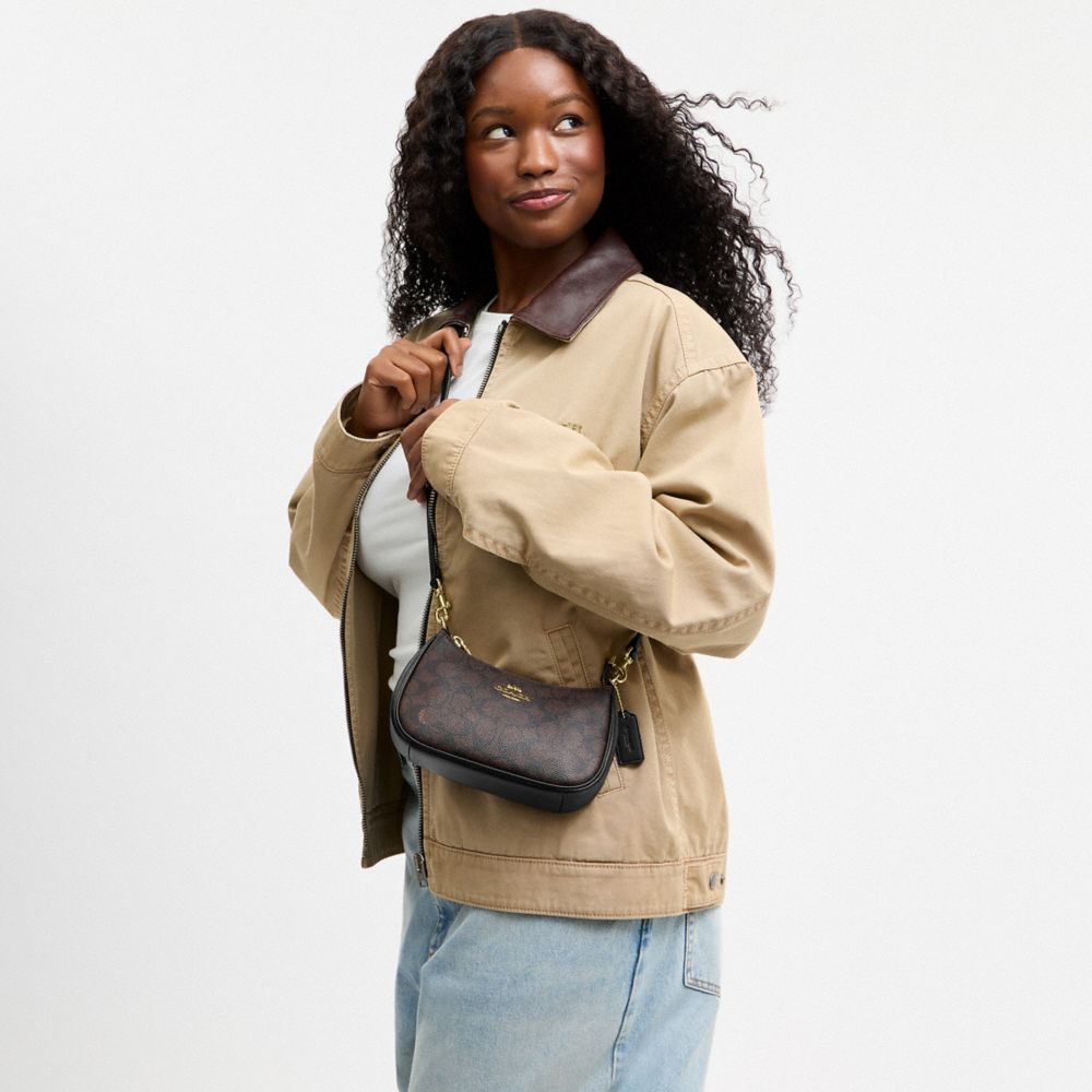 TERI MINI CROSSBODY BAG IN SIGNATURE CANVAS