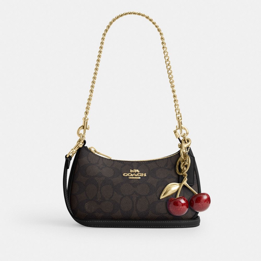 TERI MINI CROSSBODY BAG IN SIGNATURE CANVAS