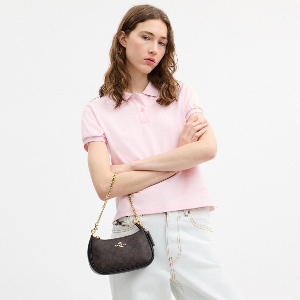 TERI MINI CROSSBODY BAG IN SIGNATURE CANVAS
