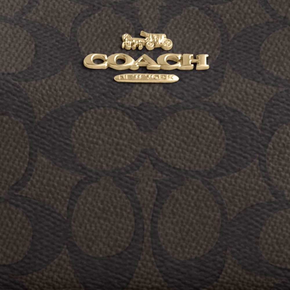 TERI MINI CROSSBODY BAG IN SIGNATURE CANVAS