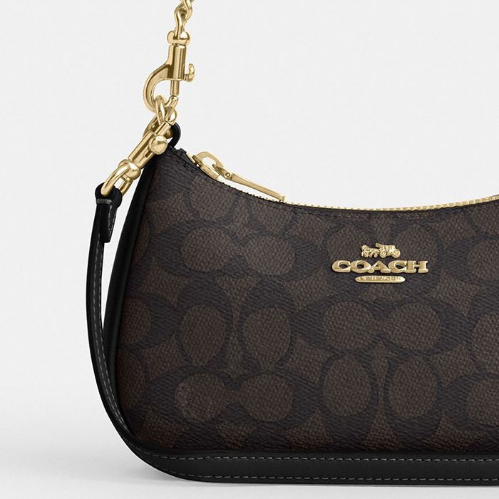 TERI MINI CROSSBODY BAG IN SIGNATURE CANVAS