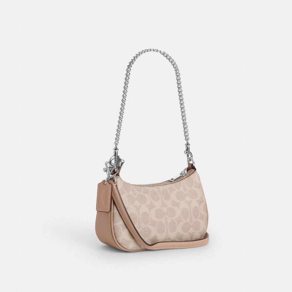 TERI MINI CROSSBODY BAG IN SIGNATURE CANVAS