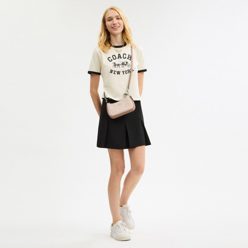 TERI MINI CROSSBODY BAG IN SIGNATURE CANVAS