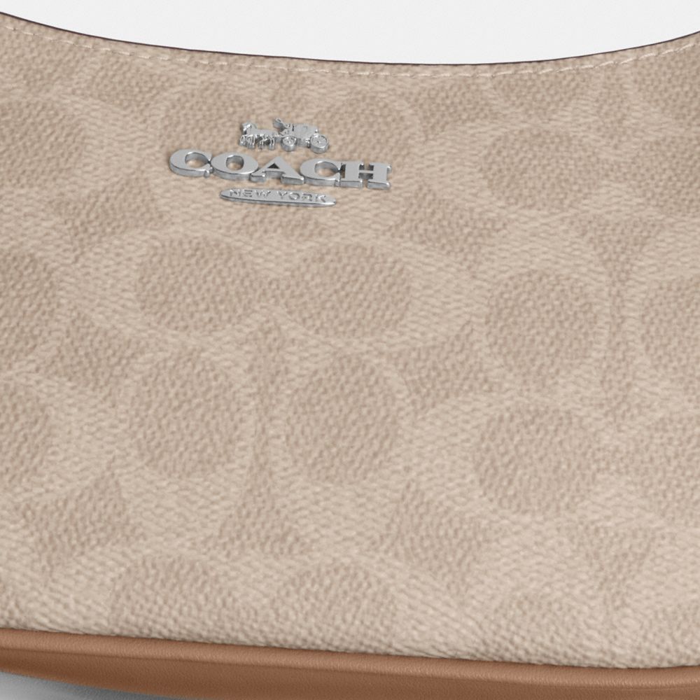 TERI MINI CROSSBODY BAG IN SIGNATURE CANVAS