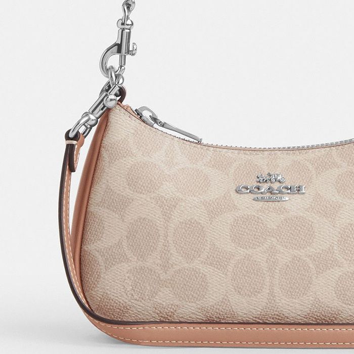 TERI MINI CROSSBODY BAG IN SIGNATURE CANVAS
