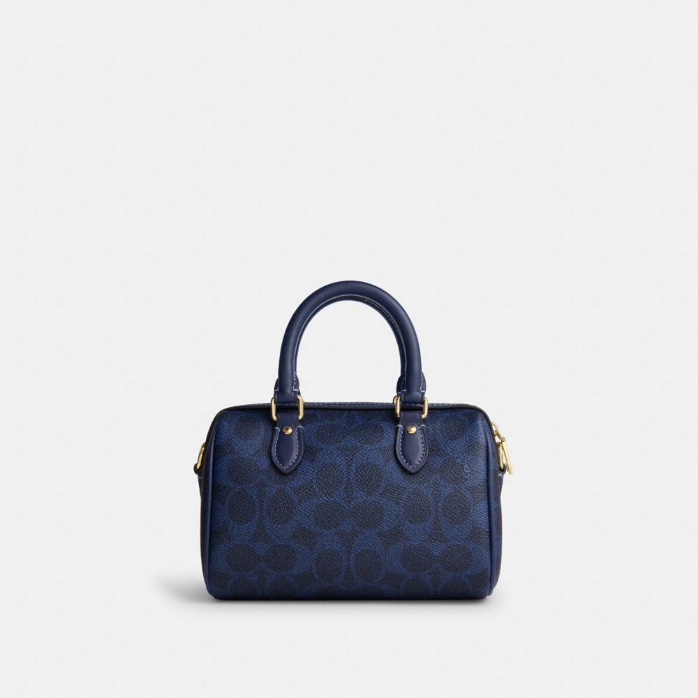 MINI ROWAN CROSSBODY BAG IN SIGNATURE CANVAS