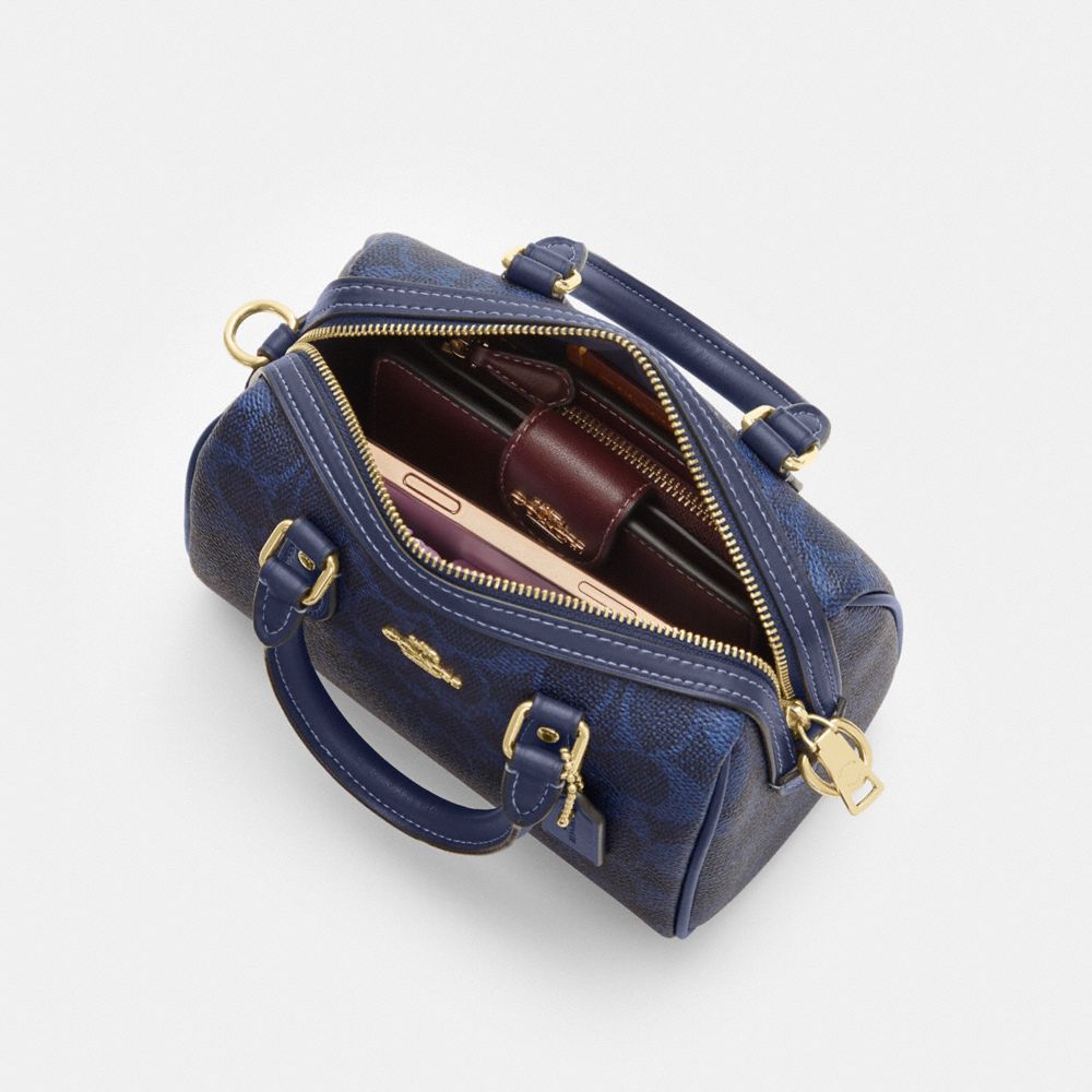 MINI ROWAN CROSSBODY BAG IN SIGNATURE CANVAS