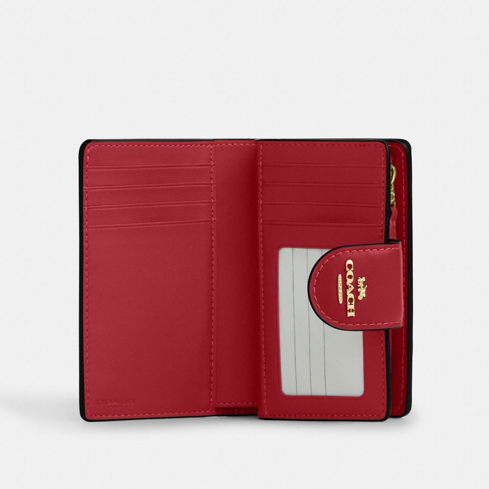 MEDIUM CORNER ZIP WALLET IN SIGNATURE CANVAS