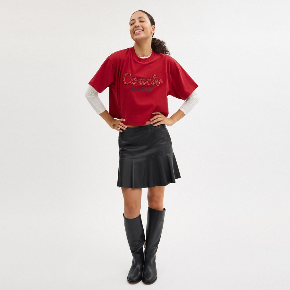 NEW YEAR COACH SNAKE SCRIPT CROPPED T-SHIRT IN ORGANIC COTTON