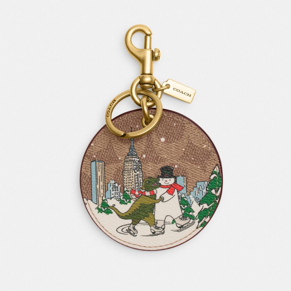 COACH CY297 Holiday Bag Charm In Signature Canvas With Rexy And Snowman BRASS/TAN MULTI