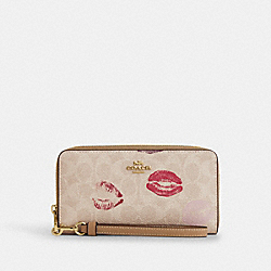 Long Zip Around Wallet In Signature Canvas With Lips Print - CZ955 - Gold/Sand Multi