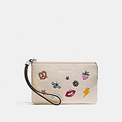 CORNER ZIP WRISTLET WITH ALLOVER MOTIFS - COACH f25839 - CHALK MULTI/SILVER