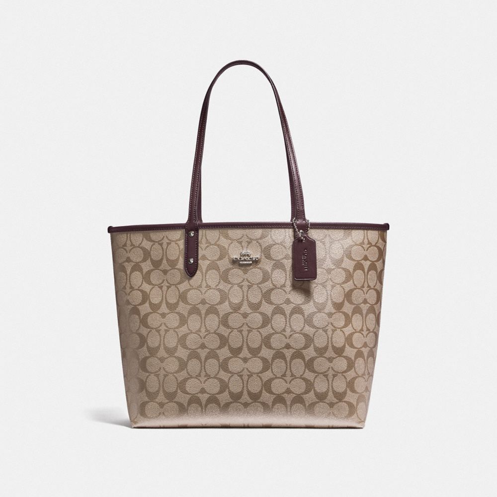 REVERSIBLE CITY TOTE IN SIGNATURE CANVAS - F25849 - PLATINUM/OXBLOOD/SILVER