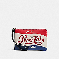 CORNER ZIP WRISTLET WITH PEPSIÂ® MOTIF - CHALK/BLACK/SILVER - COACH F25865