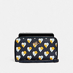 PHONE WALLET WITH CHECKER HEART PRINT - MIDNIGHT MULTI/LIGHT GOLD - COACH F25963