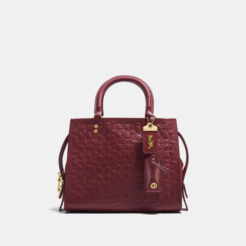 COACH F26839 - ROGUE 25 IN SIGNATURE LEATHER WITH FLORAL BOW PRINT INTERIOR BORDEAUX/OLD BRASS
