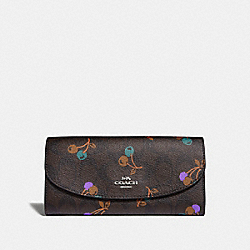 COACH SLIM ENVELOPE WALLET IN SIGNATURE CANVAS WITH CHERRY PRINT - BROWN MULTI/SILVER - F31562