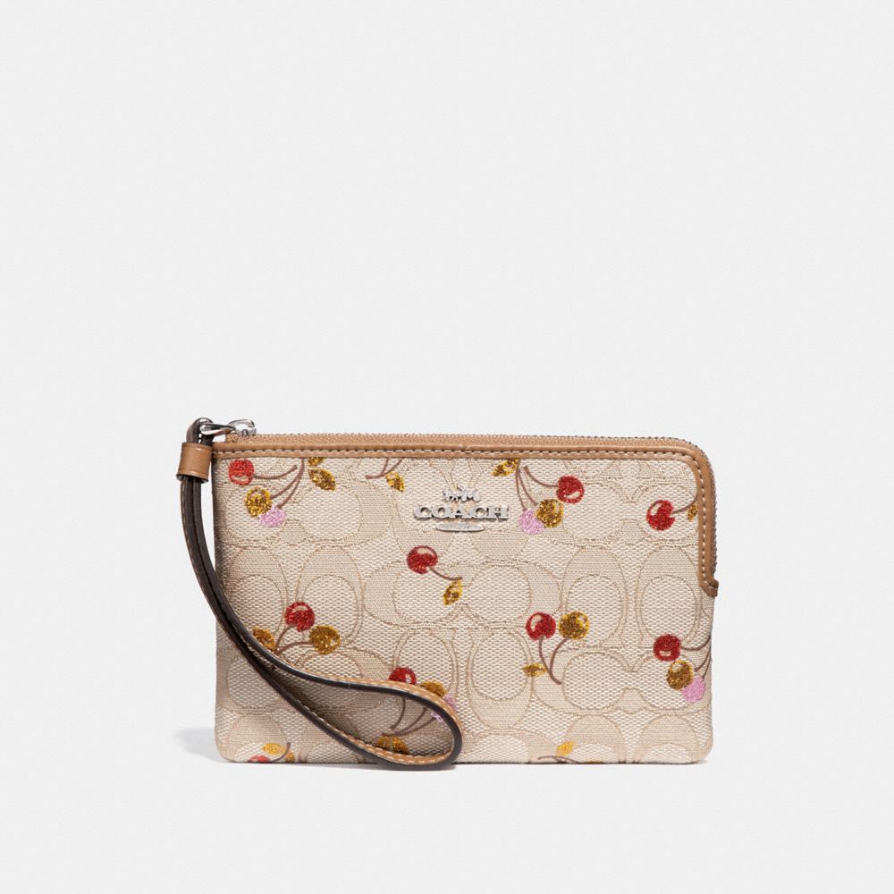 CORNER ZIP WRISTLET IN SIGNATURE JACQUARD WITH CHERRY PRINT - SILVER/LIGHT KHAKI MULTI - COACH F31577