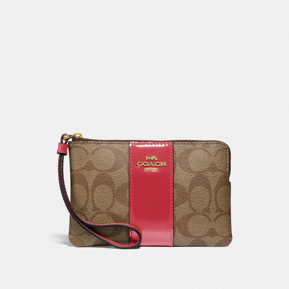 COACH CORNER ZIP WRISTLET IN SIGNATURE CANVAS - KHAKI/TRUE RED/LIGHT GOLD - F34650