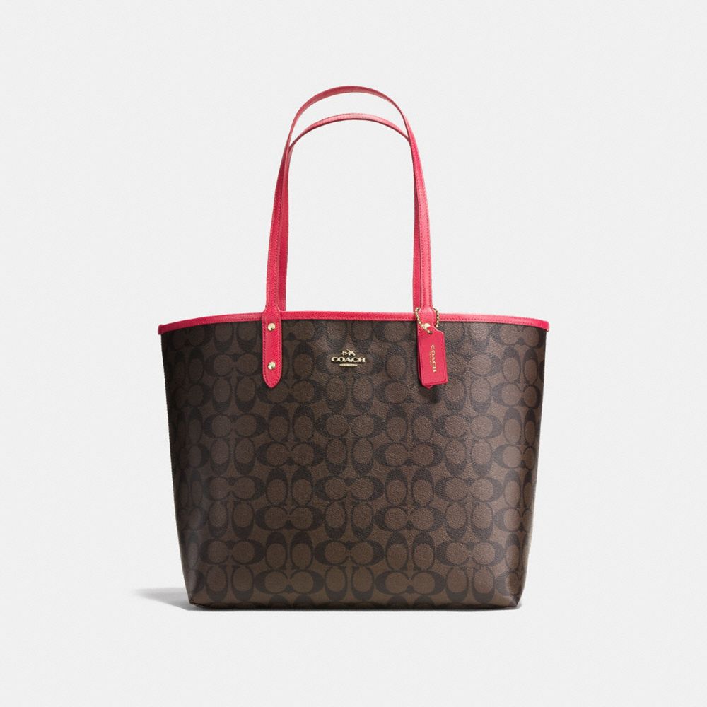 REVERSIBLE CITY TOTE IN SIGNATURE CANVAS - BROWN/NEON PINK/LIGHT GOLD - COACH F36658