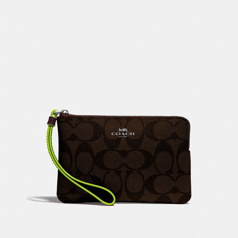 CORNER ZIP WRISTLET IN SIGNATURE CANVAS - BROWN/NEON YELLOW/SILVER - COACH F39213