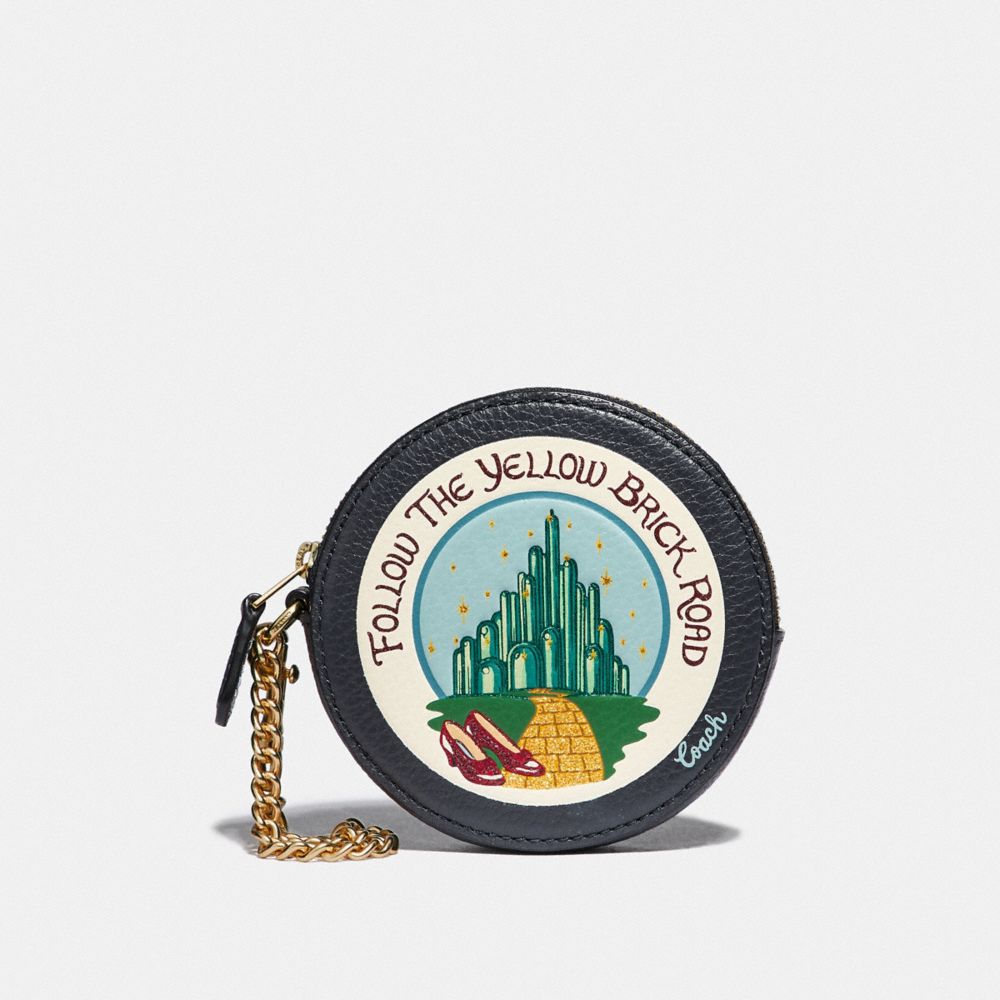 ROUND COIN CASE WITH EMERALD CITY - F39270 - MIDNIGHT NAVY/LIGHT GOLD