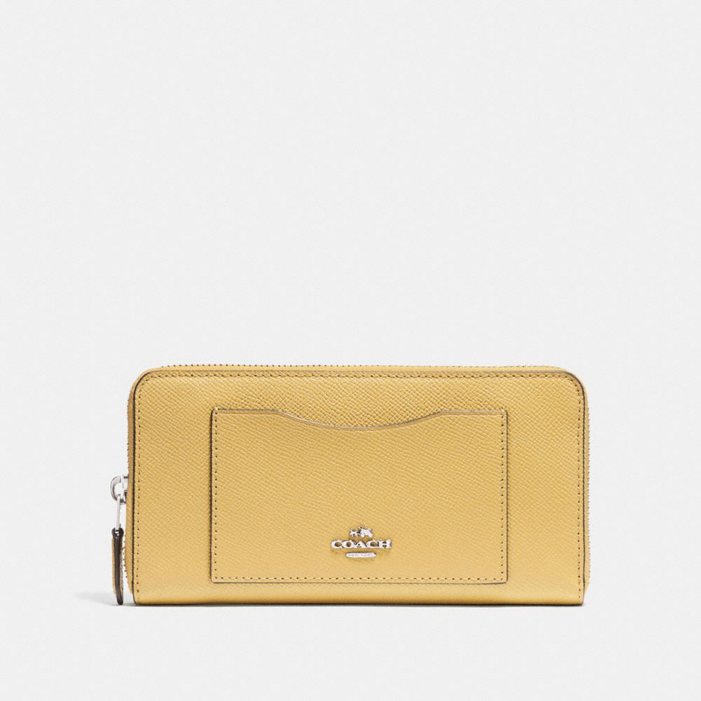 light yellow coach purse