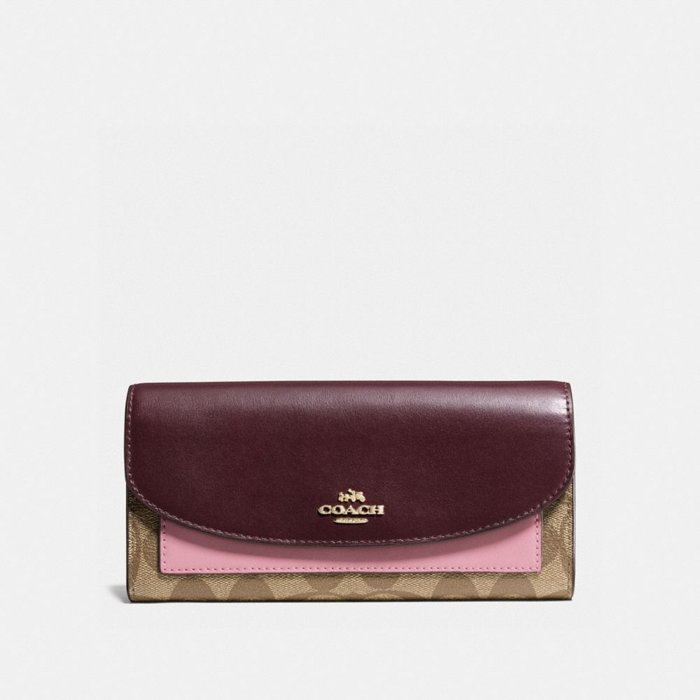 COACH SLIM ENVELOPE WALLET IN COLORBLOCK SIGNATURE CANVAS - KHAKI/OXBLOOD MULTI/LIGHT GOLD - f56494