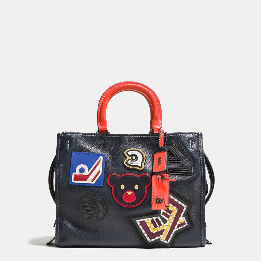 COACH F57231 ROGUE WITH VARSITY PATCHES BP/NAVY