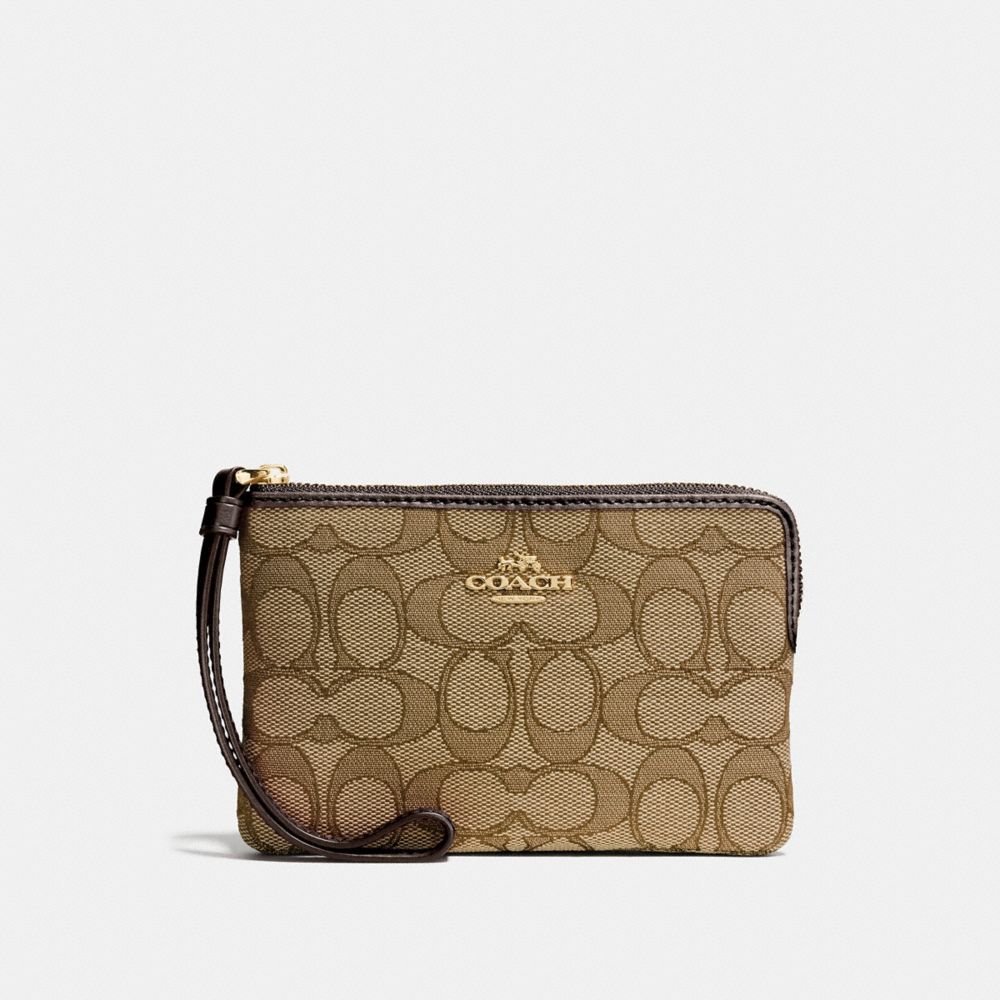 COACH CORNER ZIP WRISTLET IN SIGNATURE CANVAS - KHAKI/BROWN/LIGHT GOLD - F58033