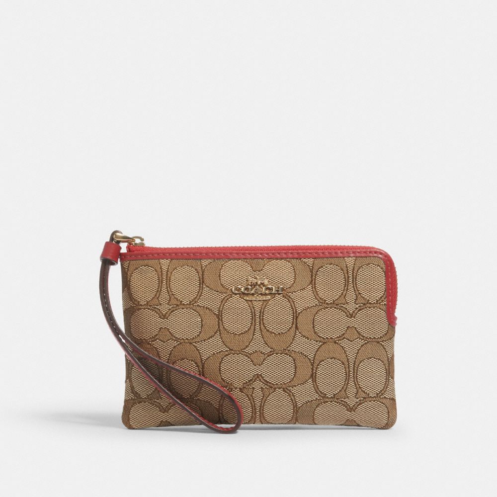 CORNER ZIP WRISTLET IN SIGNATURE CANVAS - IM/KHAKI/TRUE RED - COACH F58033