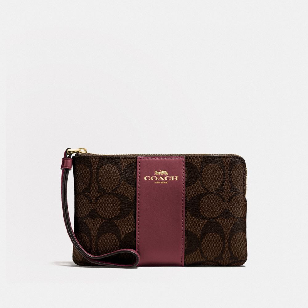 CORNER ZIP WRISTLET IN SIGNATURE CANVAS - IM/BROWN/WINE - COACH F58035